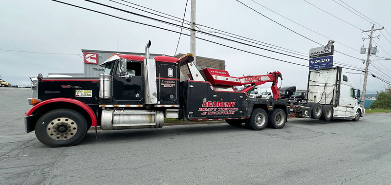 Academy Towing - our heavy duty 45 ton tow trucks serve HRM and Kentville areas Academy Towing - our heavy duty 45 ton tow trucks serve HRM and Kentville areas