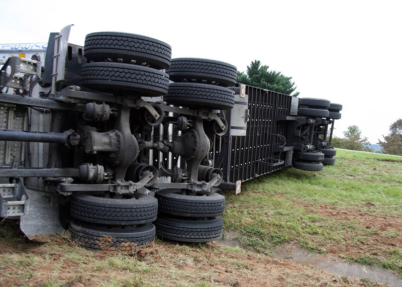 Tractor trailer off the road on its side Tractor trailer off the road on its side
