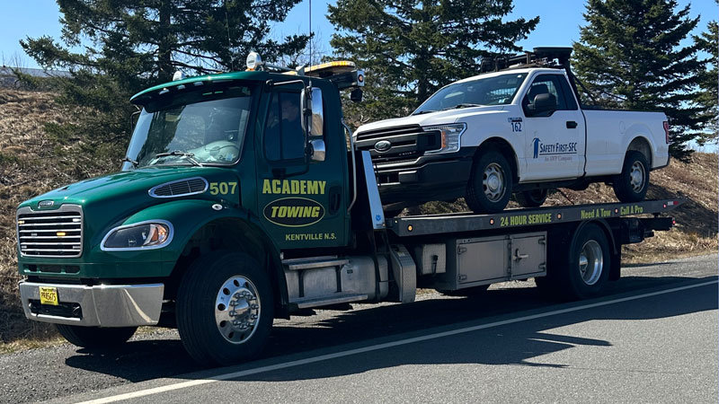 Academy Towing moving a pickup truck Academy Towing moving a pickup truck